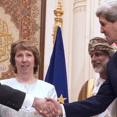 Sect. of State John Kerry (R) and Iranian Foreign Minister Javad Zarif (L) shake hands in Muscat on November 9, 2014. (NICHOLAS KAMM/AFP/Getty Images)