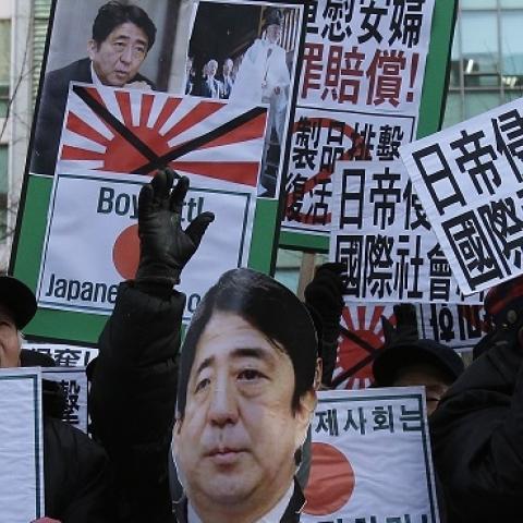 South Korean protesters shout slogans during a anti-Japan rally in front of the Japanese embassy on December 27, 2013 in Seoul, South Korea. (Chung Sung-Jun/Getty Images)