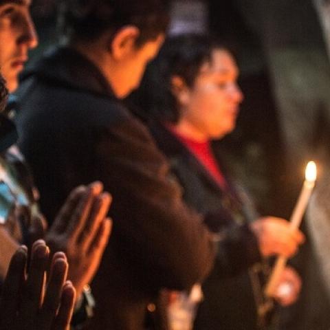 Iraqi Christians light candles inside a shrine in the grounds of Mazar Mar Eillia (Mar Elia) Catholic Church on December 12, 2014 in Erbil, Iraq. (Matt Cardy/Getty Images)