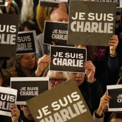 People hold signs reading 'I am Charlie' during a rally in Monaco on January 8, 2015, a day after a deadly attack on the Paris headquarters of French satirical weekly Charlie Hebdo. (VALERY HACHE/AFP/Getty Images)
