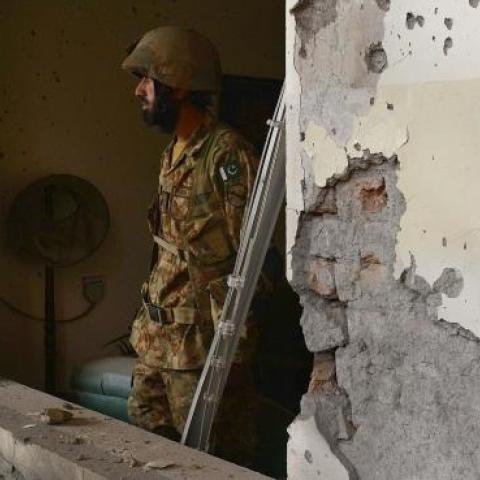 Pakistani army soldiers stand guard at the site of the militants' attack on the army-run school in Peshawar on December 18, 2014. (A Majeed/AFP/Getty Images)