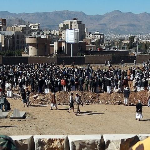 Yemeni soldiers watching a funeral for policemen killed by a car bombing in Sanaa, January 9, 2015 (Mohammed Huwais/AFP/Getty Images).