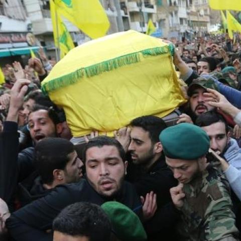 Lebanese Hezbollah supporters carry the coffin of militant Jihad Mughniyeh during his funeral in a southern Beirut suburb on January 19, 2015. (JOSEPH EID/AFP/Getty Images)