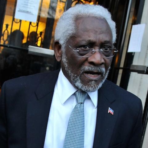 Raymond Joseph stands outside the Haitian embassy in Washington, DC, on January 19, 2010, following a candle light vigil one week after a massive earthquake destroyed Port-au-Prince. (Alex Ogle/AFP/Getty Images)