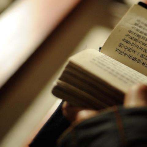 A catholic reads the Bible at the temporary Bailu Township Church on December 24, 2008 in Pengzhou of Sichuan Province, China. (China Photos/Getty Images)