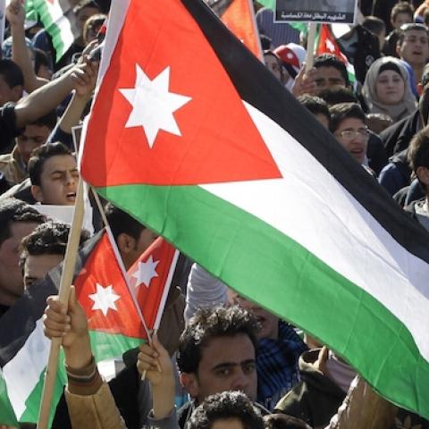 Jordanian students shout slogans and wave flags on February 5, 2015 in the capital Amman during a rally against the Islamic state (IS) group and in reaction to the burning alive of Jordanian pilot Maaz al-Kassasbeh. (KHALIL MAZRAAWI/AFP/Getty Images)