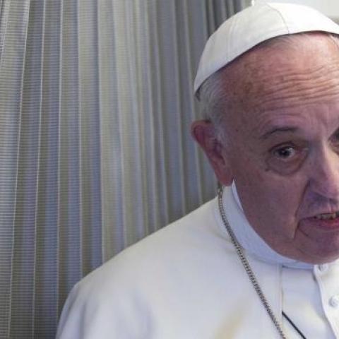 Pope Francis speaks to the press aboard a plane during his trip to the Philippines on January 15, 2015. (ALESSANDRA TARANTINO/AFP/Getty Images)