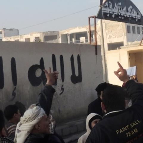 People demonstrate outside the offices of the Al-Qaeda-linked Islamic State of Iraq and the Levant (ISIL) on January 6, 2014 in the northern Syrian city of Aleppo. (MOHAMMED WESAM/AFP/Getty Images)