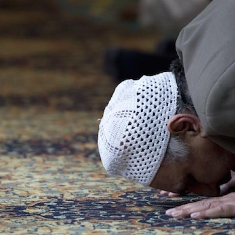 A muslim man prays during a prayer session for murdered aid worker Alan Henning in Manchester Central Mosque in Manchester, north west England on October 4, 2014. (OLI SCARFF/AFP/Getty Images)