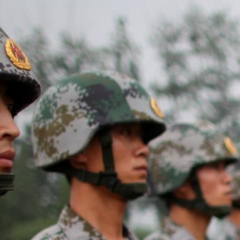 People's Liberation Army (PLA) soldiers during a reporting trip to the Third Guard Division of the PLA on July 28, 2009 in Beijing, China. (Feng Li/Getty Images)