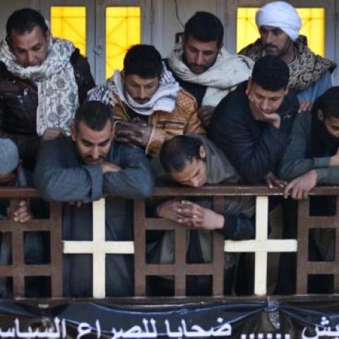 Egyptian Coptic Christians attend a memorial ceremony for relatives murdered by Islamic State group militants in Libya, on February 16, 2015, in the village of al-Awar in Egypt's southern province of Minya. (MOHAMED EL-SHAHED/AFP/Getty Images)