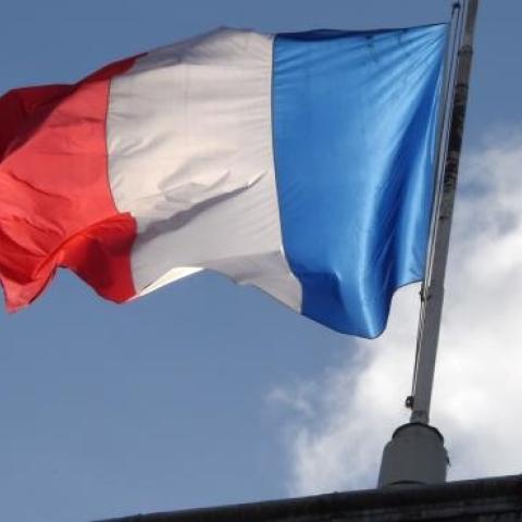 The French flag flies at half mast at the Elysee Palace during a Unity rally Marche Republicaine on January 11, 2015 in Paris. (DOMINIQUE FAGET/AFP/Getty Images)