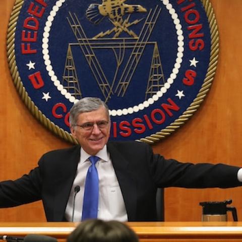 FCC Chairman Tom Wheeler (C) holds hands with FCC Commissioners Mignon Clyburn (L) and Jessica Rosenworcel during an open hearing on Net Neutrality at the FCC headquarters February 26, 2015 in Washington, DC. (Mark Wilson/Getty Images)