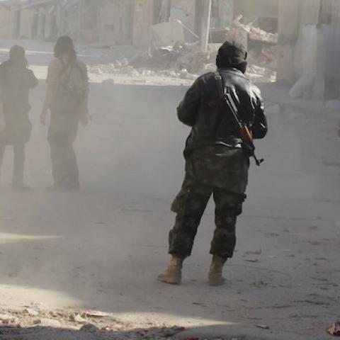 Members of the jihadist group Al-Nusra Front fire homemade mortar rounds during fighting with government forces on February 8, 2014 in the Syrian village of Aziza, on the southern outskirts of Aleppo. (BARAA AL-HALABI/AFP/Getty Images)