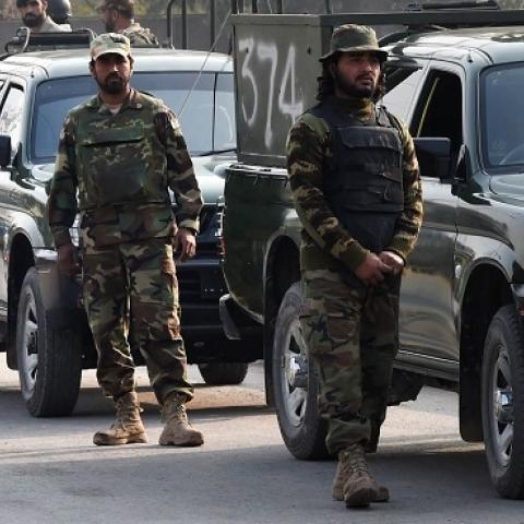 Pakistani soldiers cordon off the site of an attack by Taliban gunmen on a school in Peshawar on December 16, 2014. (A Majeed/AFP/Getty Images)