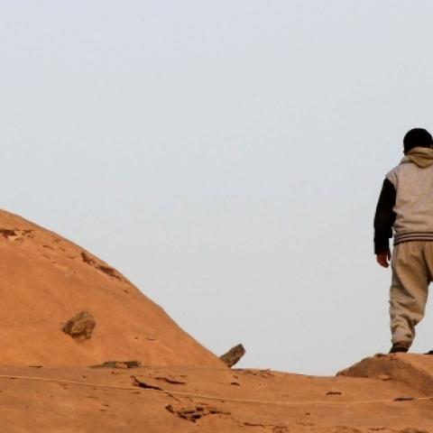 An Egyptian Coptic boy looks down from the roof of the Bishoy Monastery in Beheira province, 150 kms northwest of Cairo. (KHALED DESOUKI/AFP/Getty Images)