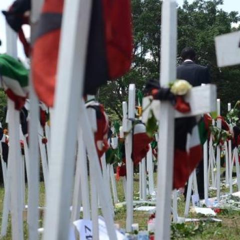 A woman looks at wooden crosses bearing names of victims at Freedom-Corner in Uhuru Park in Nairobi on April 8, 2015. (SIMON MAINA/AFP/Getty Images)