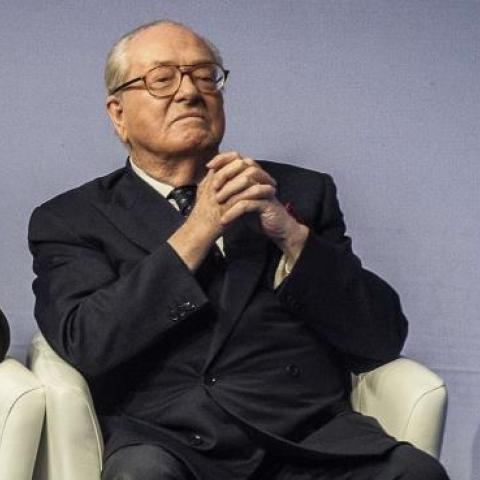 Jean-Marie Le Pen (R) and Marine Le Pen (L) listen to a speech, on November 29, 2014 in Lyon, during the 15th French National Front (FN) congress. (JEFF PACHOUD/AFP/Getty Images)