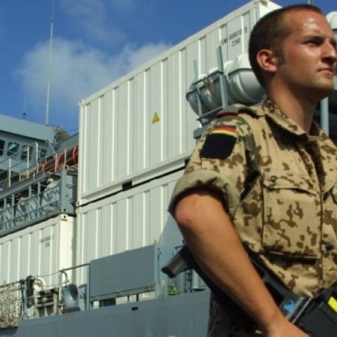 A German soldier guards the German military supply ship Elbe at the port February 21, 2003 in Djibouti Town, Djibouti. (Sean Gallup/Getty Images)