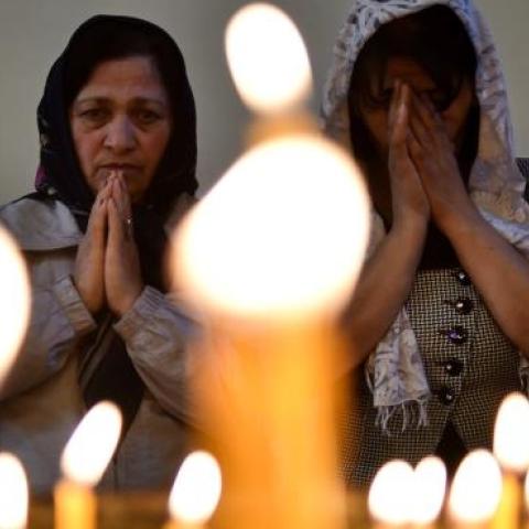 Women attend a religious service at the cathedral in Etchmiadzin, outside Yerevan, on April 23, 2015. (KIRILL KUDRYAVTSEV/AFP/Getty Images)​