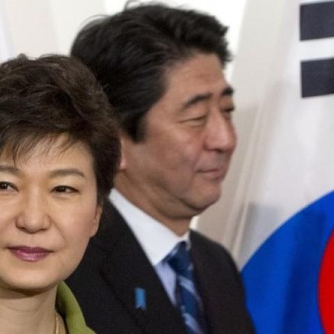 South Korean President Park Geun-hye and Japanese Prime Minister Shinzo Abe at the US ambassador's residence in The Hague on March 25, 2014. (SAUL LOEB/AFP/Getty Images