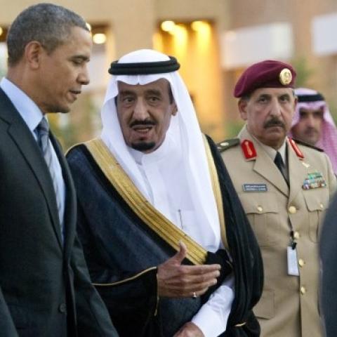 US President Barack Obama (C-L) is greeted by then-Saudi Crown Prince Salman bin Abdulaziz al-Saud (C-R) upon his arrival at Rawdat Khurayim on March 28, 2014. (SAUL LOEB/AFP/Getty Images)