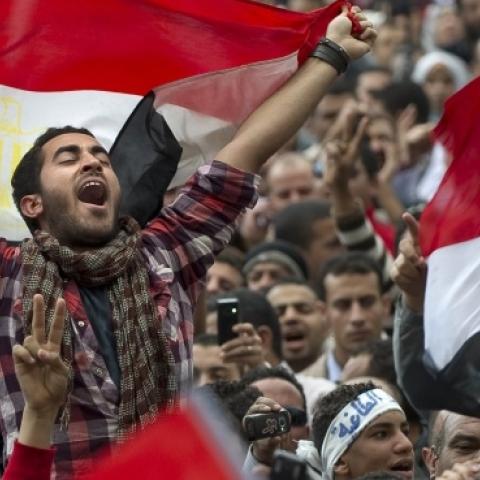 Egyptian anti-goverment demonstrators wave Egyptian flags at Cairo's Tahrir Square on February 10, 2011. (PEDRO UGARTE/AFP/Getty Images)