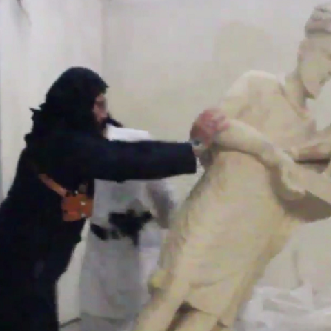 Screenshot of ISIS fighters destroying artifacts