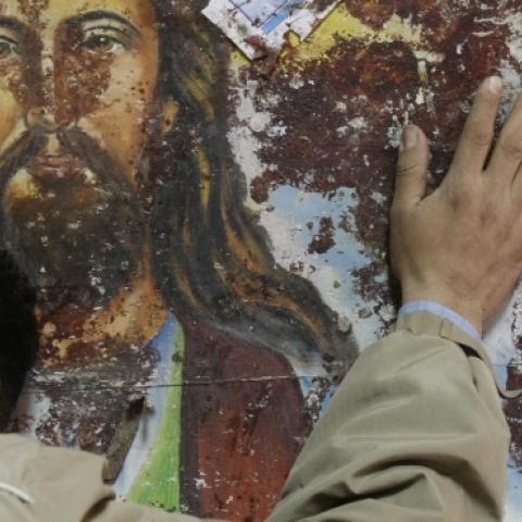 An Egyptian Christian mourns following a New Year's Eve car bomb attack on the Coptic church in Alexandria in which 21 people were killed, on January 2, 2011 outside the Al-Qiddissine (The Saints) church. (MOHAMMED ABED/AFP/Getty Images)
