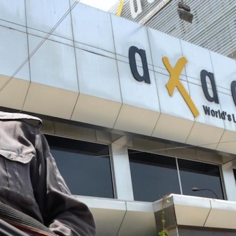 Pakistani security forces stands guard outside the headquarters of Axact, a software firm during raids by Federal Investigation Agency (FIA) in Karachi, Pakistan, on May 27, 2015. (Qaisar Khan/Anadolu Agency/Getty Images)