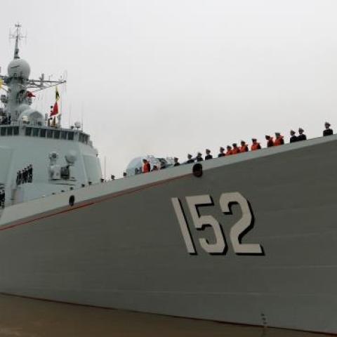 Soldiers of Chinese navy stand in line on the ship before they go to the Somalia Waters on April 3, 2015 in Zhoushan, China. (ChinaFotoPress via Getty Images)