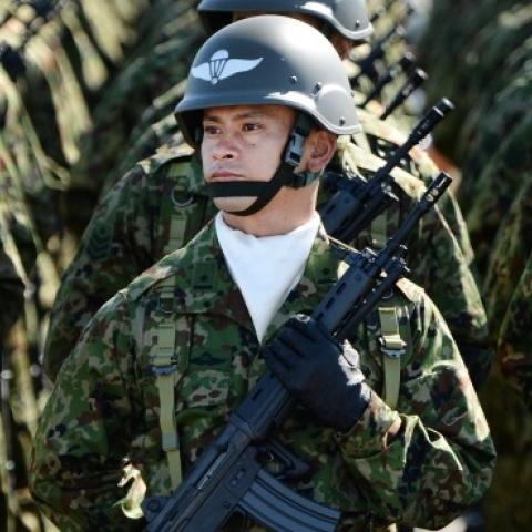 Japanese soldiers listen to Prime Minister Shinzo Abe at the Ground Self-Defence Force's Asaka training ground on October 27, 2013. (TORU YAMANAKA/AFP/Getty Images)