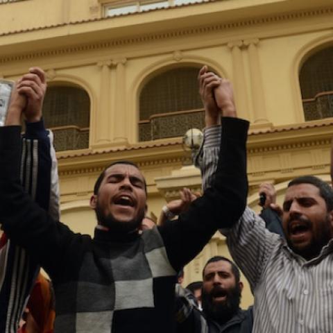 Members of the Egyptian Muslim brotherhood gather in front the party's headquarters in Cairo on March 22, 2013. (KHALED DESOUKI/AFP/Getty Images)