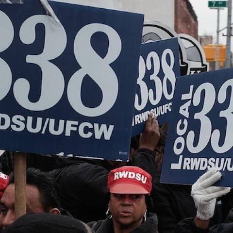 Workers and supporters hold up union signs during a rally, March 4, 2015, Brooklyn NY. (Spencer Platt/Getty Images)