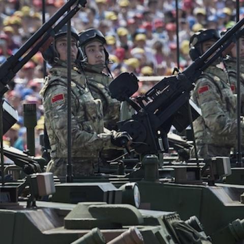 Chinese soldiers pass in front of Tiananmen Square and the Forbidden City during a military parade on September 3, 2015 in Beijing, China. (Kevin Frayer/Getty Images)