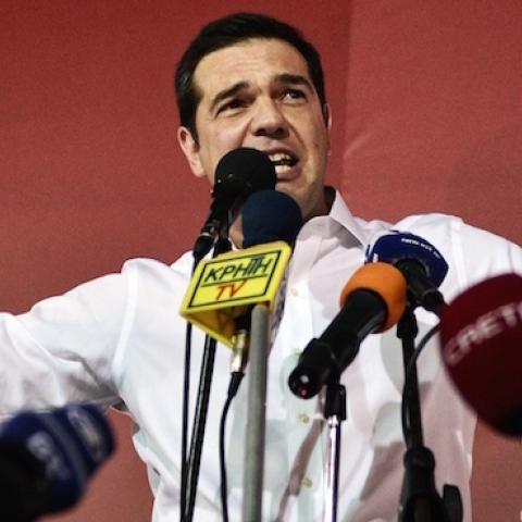 Syriza leader Alexis Tsipras celebrates after his party's victory in the Greek general elections at his campaign headquarters in Athens, September 20, 2015. (LOUISA GOULIAMAKI/AFP/Getty Images)