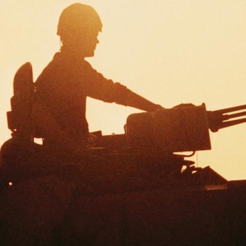 Silhouette of Challenger tank crewman in turret, circa 1991. (Roger Ryan/Crown Copyright/IWM via Getty Images)