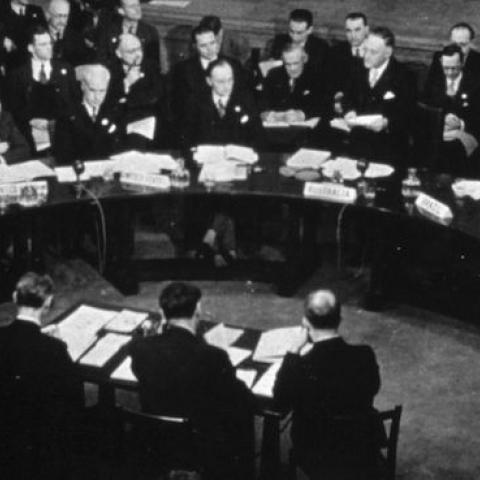 Delegates at the first session of the UN Security Council Council sit round a half moon table attended by officials, January 17, 1946. (MPI/Getty Images)