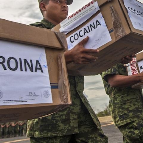 Members of the Mexican Army carry boxes with heroin, cocaine and methamphetamine to be incinerated at a military base in Monterrey, Nuevo Leon state, on August 23, 2013. (Julio Cesar Aguilar/AFP/Getty Images)