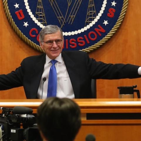 FCC Chairman Tom Wheeler (C) holds hands with FCC Commissioners Mignon Clyburn (L) and Jessica Rosenworcel during an open hearing on Net Neutrality at the FCC headquarters February 26, 2015 in Washington, DC. (Mark Wilson/Getty Images)