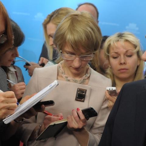 Russia's Prime Minister Vladimir Putin (R) speaks with journalists of the government press pool in Moscow on March 7, 2012. (ALEXEY NIKOLSKY/AFP/Getty Images)