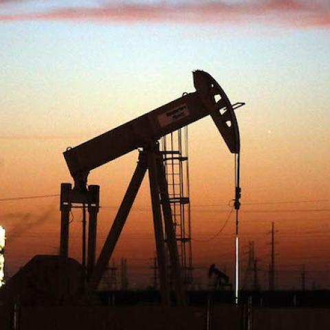 An oil pumpjack works at dawn in the Permian Basin oil field on January 20, 2016 in the oil town of Andrews, Texas. (Spencer Platt/Getty Images)