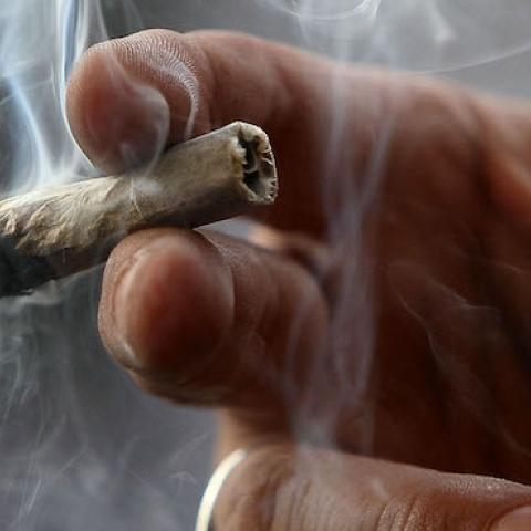 Dave Karp smokes marijuana at the Berkeley Patients Group on March 25, 2010 in Berkeley, California. (Justin Sullivan/Getty Images)