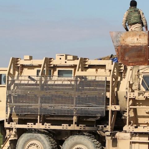 Military personnel arrive in a Chinook before Iraqi soldiers take part in a live-fire exercise for under the surveillance of US-led coalition forces at Basmaya base, Iraq on January 27, 2016. (AHMAD AL-RUBAYE/AFP/Getty Images)