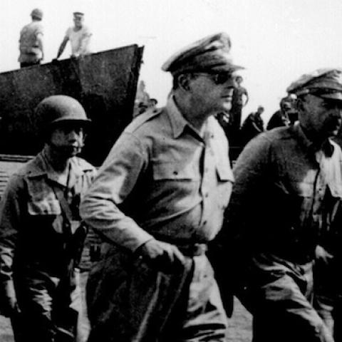 General Douglas MacArthur wades ashore during initial landings at Leyte, P.I. October 1944. (Marion Doss/Flickr)