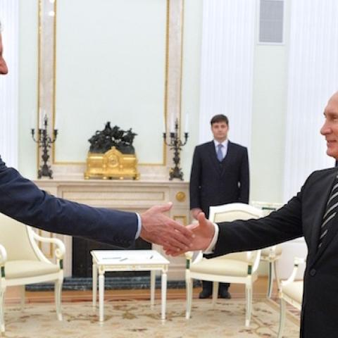 Russian President Vladimir Putin (R) greets his Syrian counterpart Bashar al-Assad (L) during a meeting at the Kremlin in Moscow on October 20, 2015. (ALEXEY DRUZHININ/AFP/Getty Images)