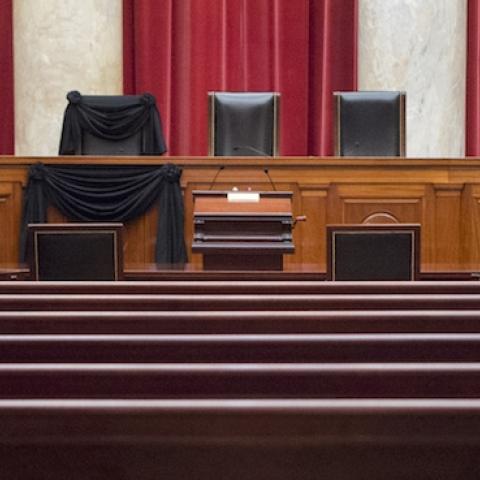 Supreme Court Associate Justice Antonin Scalia's bench chair and the bench in front of his seat are draped in black on Tuesday, February 16, 2016, following his death on February 13, 2016. (Photo By Bill Clark/CQ Roll Call)