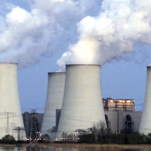 Exhaust plumes from cooling towers at the Jaenschwalde lignite coal-fired power station, April 12, 2007 at Jaenschwalde, Germany. (Sean Gallup/Getty Images)