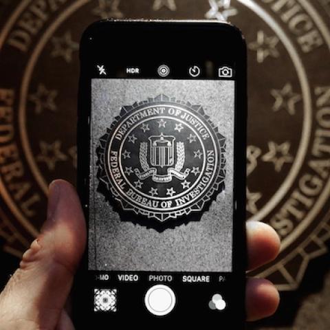 The official seal of the Federal Bureau of Investigation is seen on an iPhone's camera screen outside the J. Edgar Hoover headquarters, February 23, 2016 in Washington, DC. (Chip Somodevilla/Getty Images)
