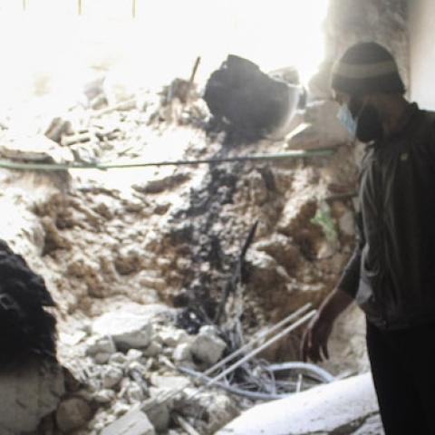Syrian opposition members inspect the site of a suspected chlorine gas attack by Assad regime forces in Jobar region of Damascus, Syria on November 13, 2014. (Lokman Sair/Anadolu Agency/Getty Images)